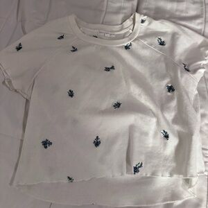 white tee shirt with flower pattern